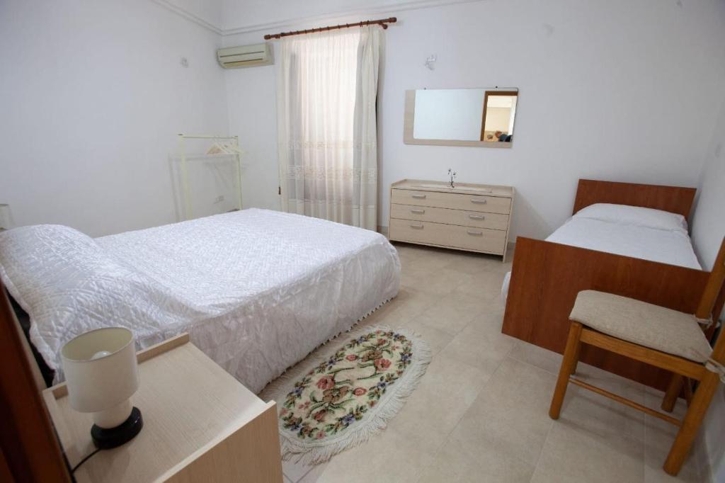 Łóżko lub łóżka w pokoju w obiekcie Casa Terranova Modica