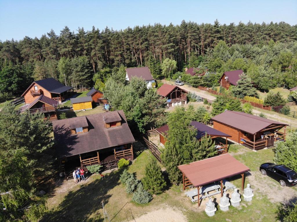 an aerial view of a home with a forest at Domki Anastazewo in Anastazewo