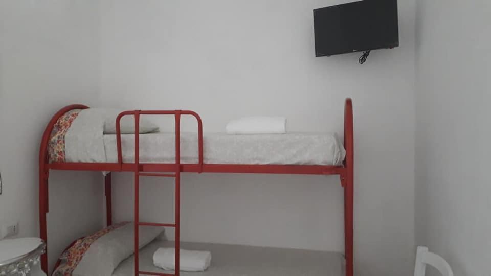 Postel nebo postele na pokoji v ubytování Orazio U Vitturisi