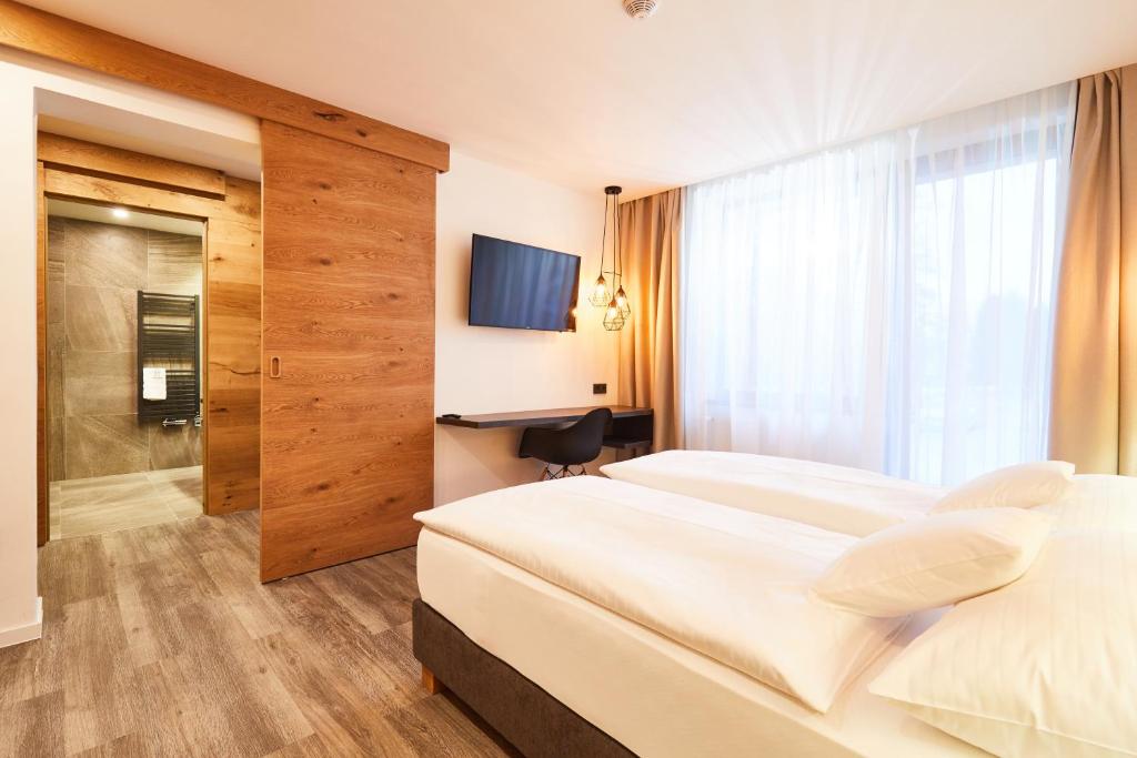 Postel nebo postele na pokoji v ubytování Resort Sněžné AMANITA