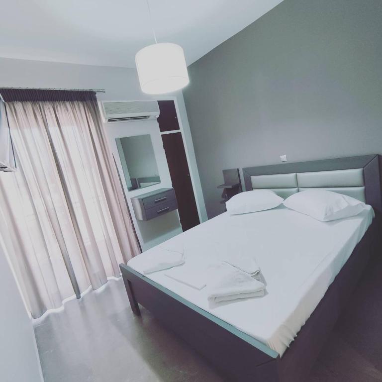 Posteľ alebo postele v izbe v ubytovaní VASO'S APARTMENTS