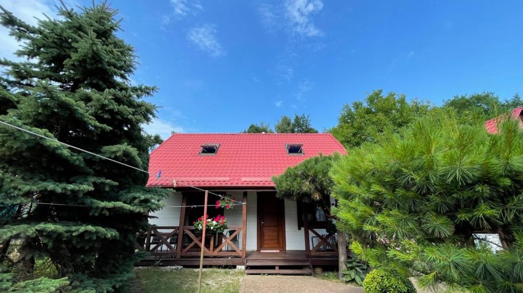 a house with a red roof and some trees at NAJBLIŻEJ MORZA DOM CAŁOROCZNY Jastarnia in Jastarnia