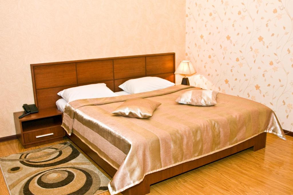 Postel nebo postele na pokoji v ubytování Laguna Hotel