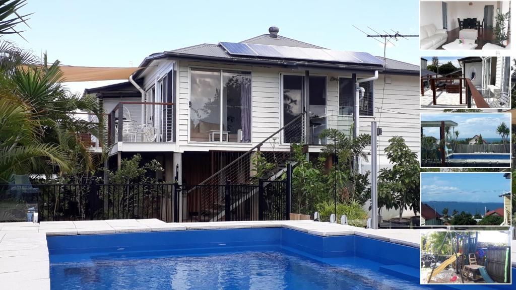 una casa con piscina frente a ella en Maple Villa - The Beach House by the bay en Brisbane