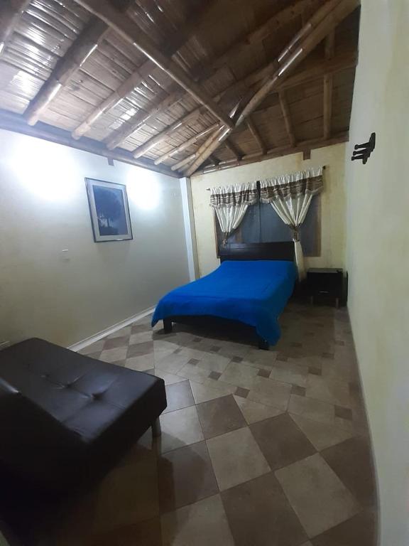 Postel nebo postele na pokoji v ubytování Hotel Campestre Inaoska Ecospa