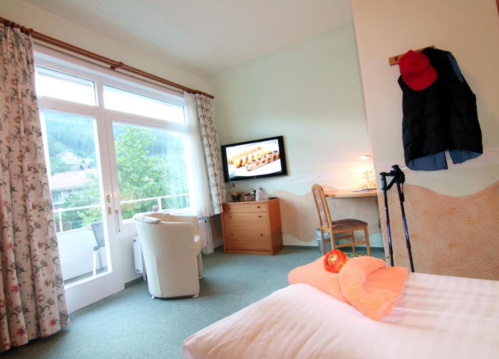 Postel nebo postele na pokoji v ubytování Hotel Weingärtner