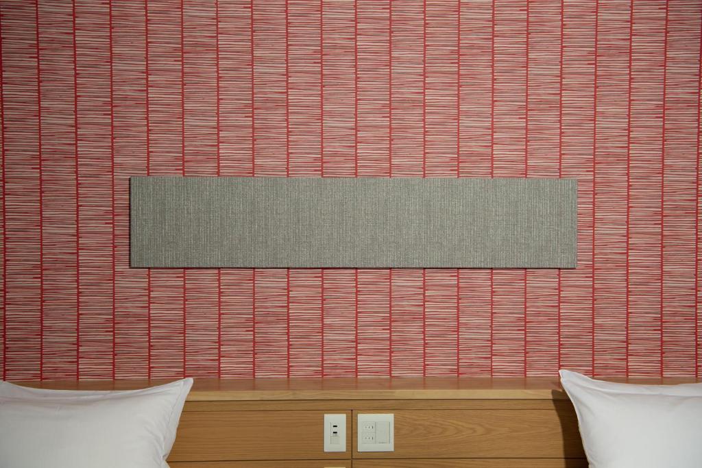Postel nebo postele na pokoji v ubytování Hotel Celeste Shizuoka