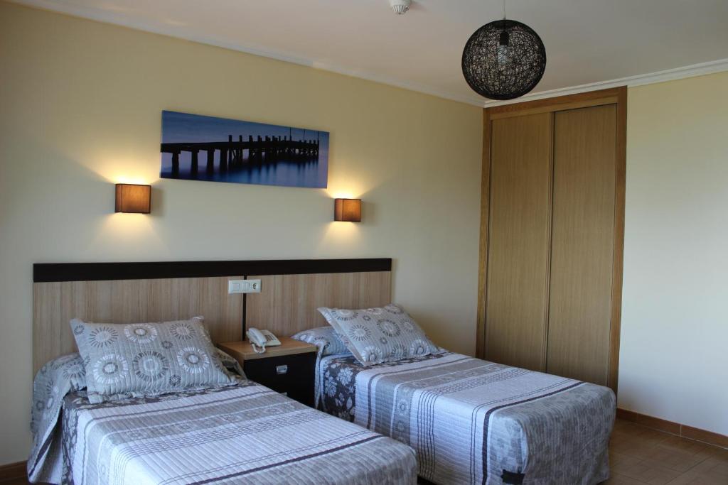 Postel nebo postele na pokoji v ubytování Hotel Estrella del Mar