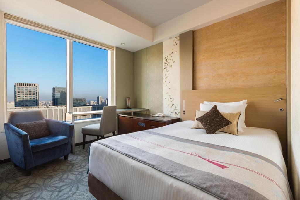 Postel nebo postele na pokoji v ubytování Hotel Metropolitan Tokyo Marunouchi