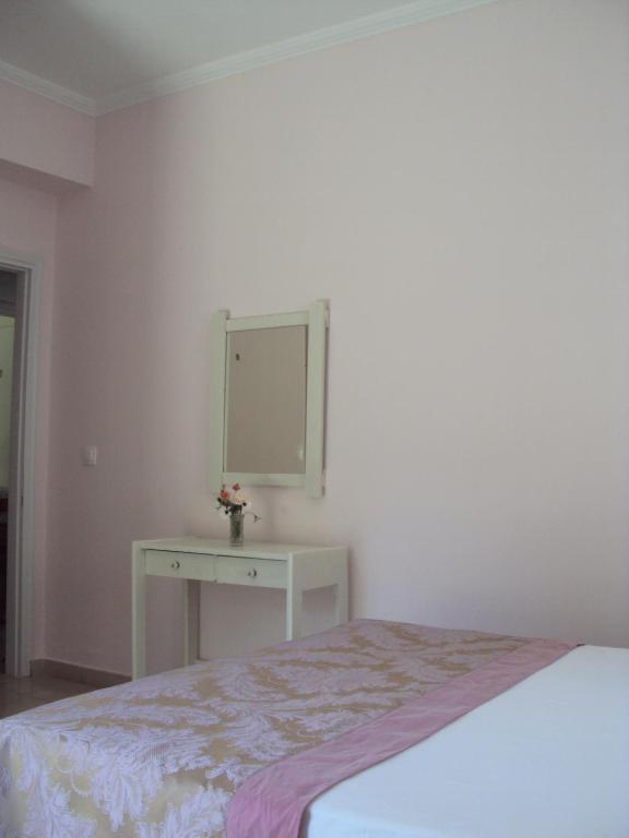 Postel nebo postele na pokoji v ubytování Yasemi Rooms