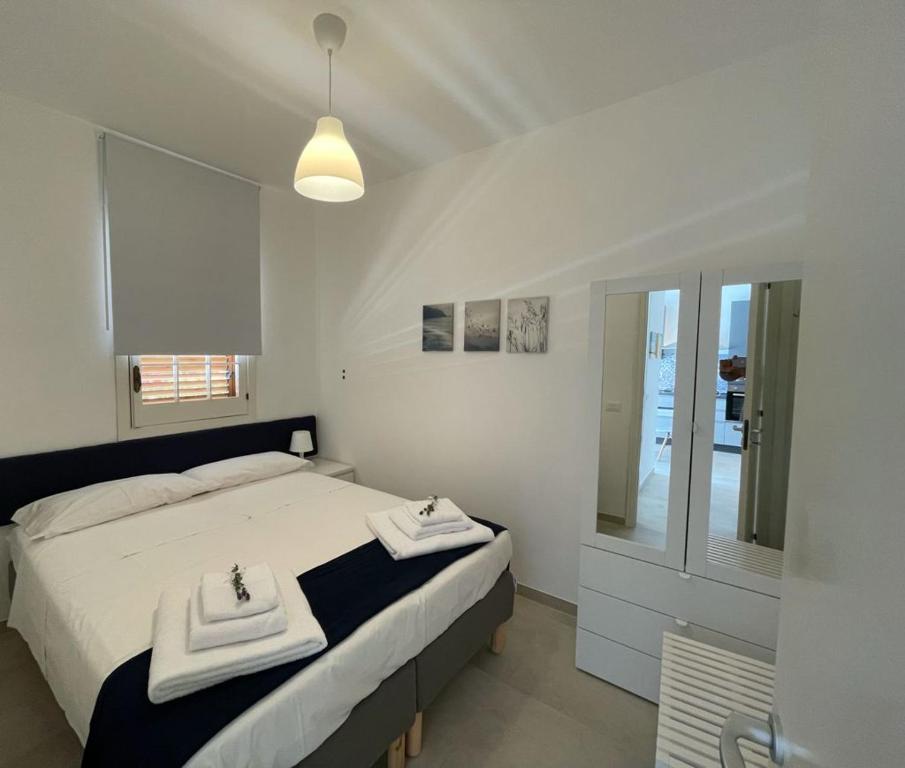 Posteľ alebo postele v izbe v ubytovaní Petals casa vacanze