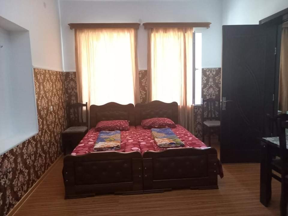 Postel nebo postele na pokoji v ubytování Guest House Fazisi