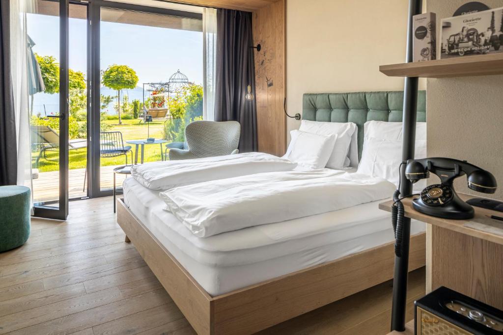Postel nebo postele na pokoji v ubytování Gloriette Guesthouse Boutiquehotel