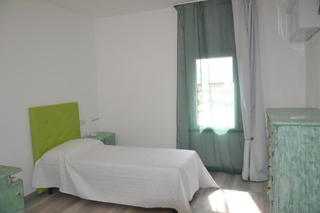 Łóżko lub łóżka w pokoju w obiekcie B&B da Baba