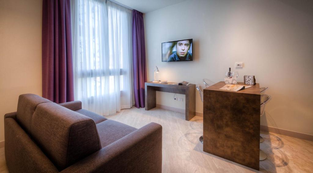 Televiisor ja/või meelelahutuskeskus majutusasutuses Forte16 View & SPA