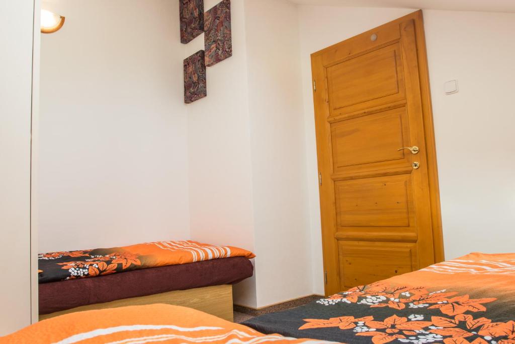 Postel nebo postele na pokoji v ubytování Apartmány Pod Lesem
