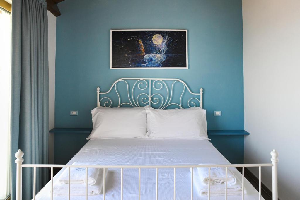 Postel nebo postele na pokoji v ubytování Signora Tita B&B Chianalea - Scilla
