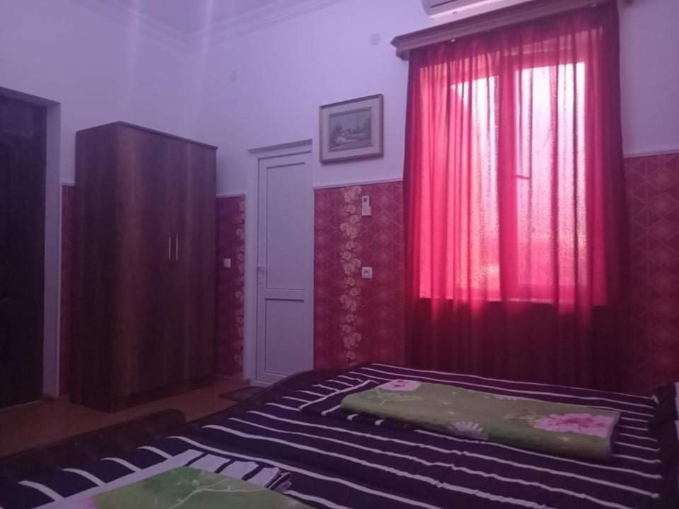 Postel nebo postele na pokoji v ubytování Guest House Fazisi