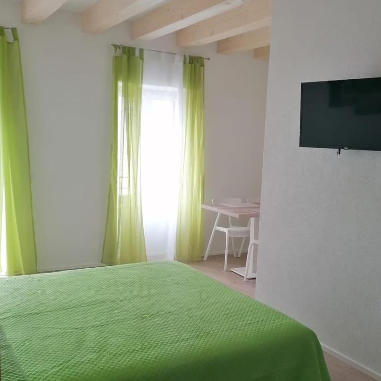 TV a/nebo společenská místnost v ubytování B&B Al Portico