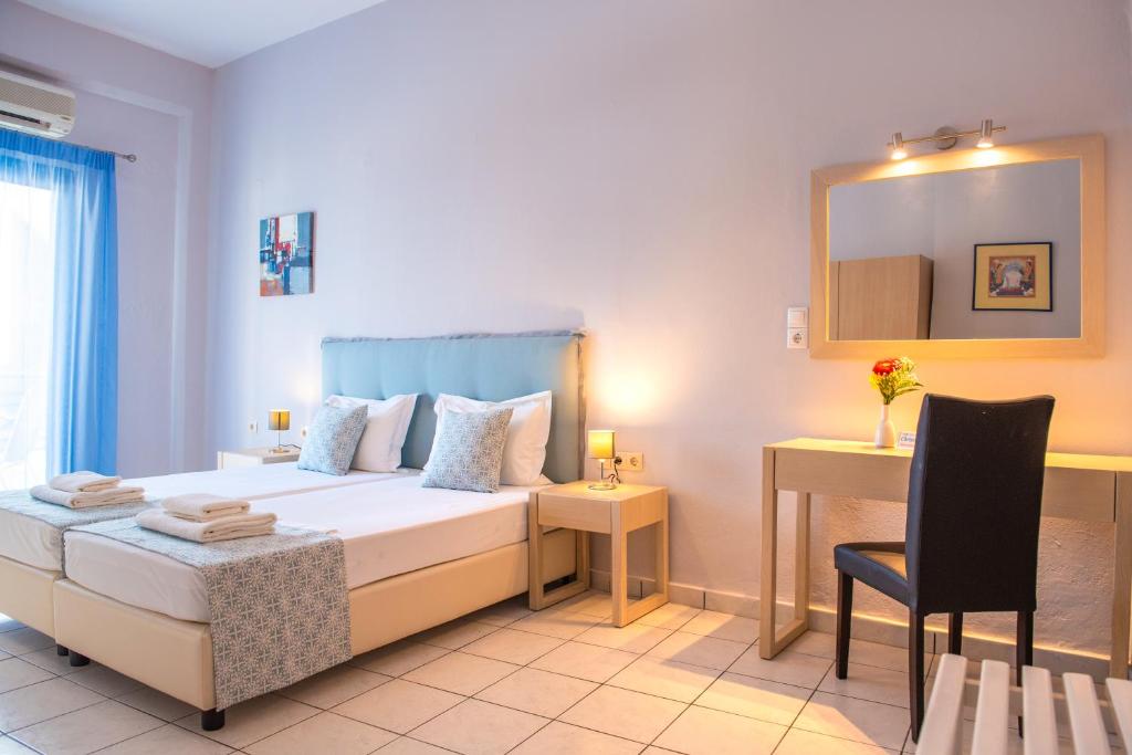 A bed or beds in a room at Christof Studios