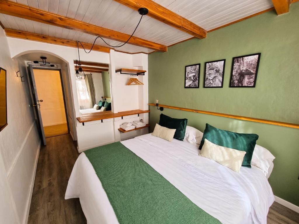 Postel nebo postele na pokoji v ubytování Hosteria Las Lucarnas