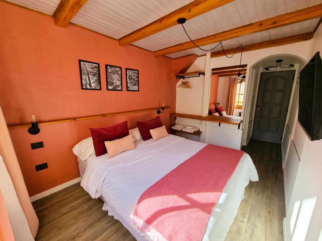 Postel nebo postele na pokoji v ubytování Hosteria Las Lucarnas