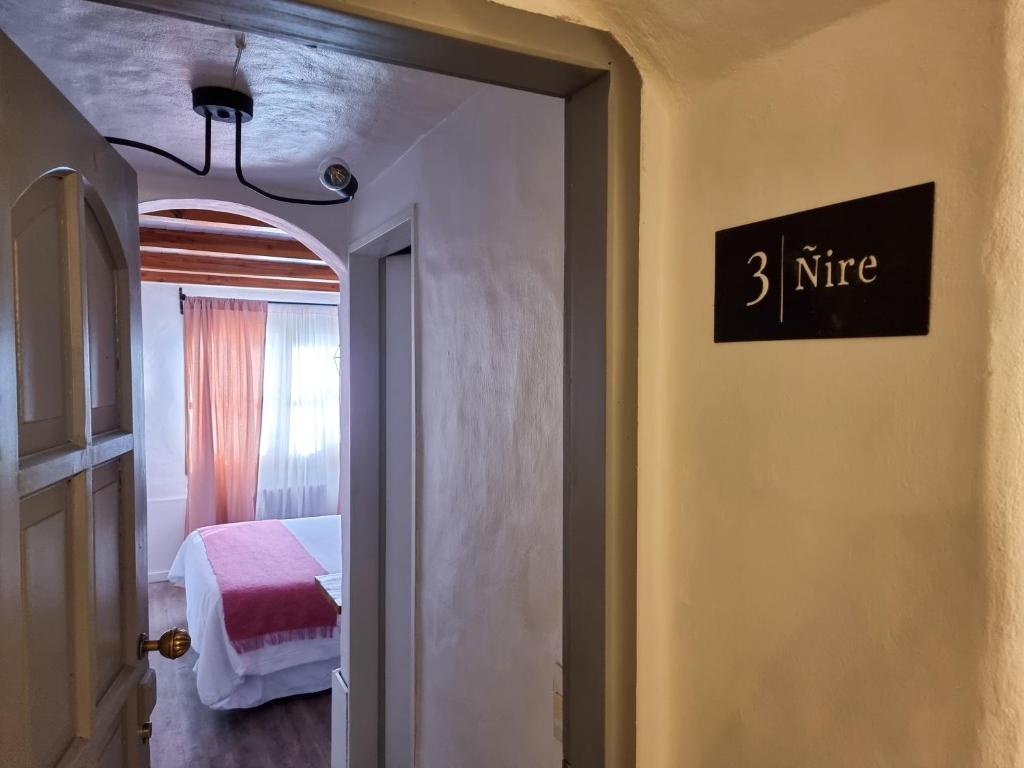 Postel nebo postele na pokoji v ubytování Hosteria Las Lucarnas