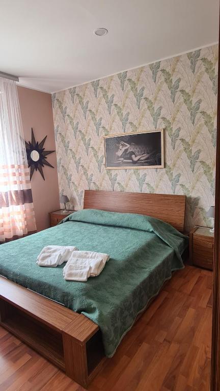 Postel nebo postele na pokoji v ubytování B&B Regina