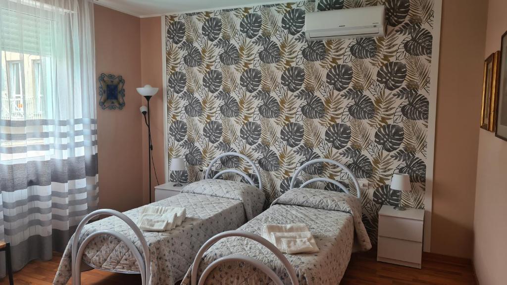 Postel nebo postele na pokoji v ubytování B&B Regina