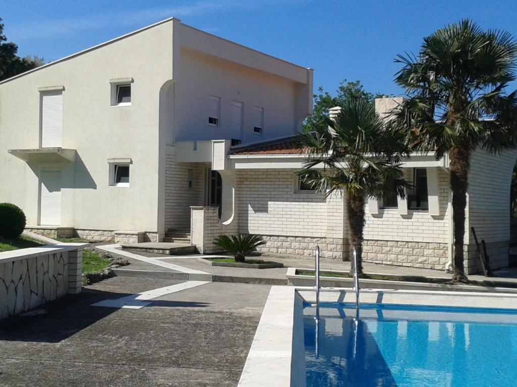 a house with a swimming pool in front of a house at Borgo Del Silenzio,Apartment With Pool in Bar