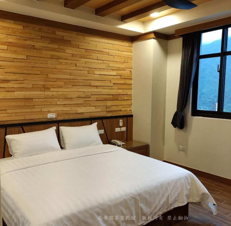 Postel nebo postele na pokoji v ubytování Gaodiyuan Tea B&B 高帝園茶業民宿