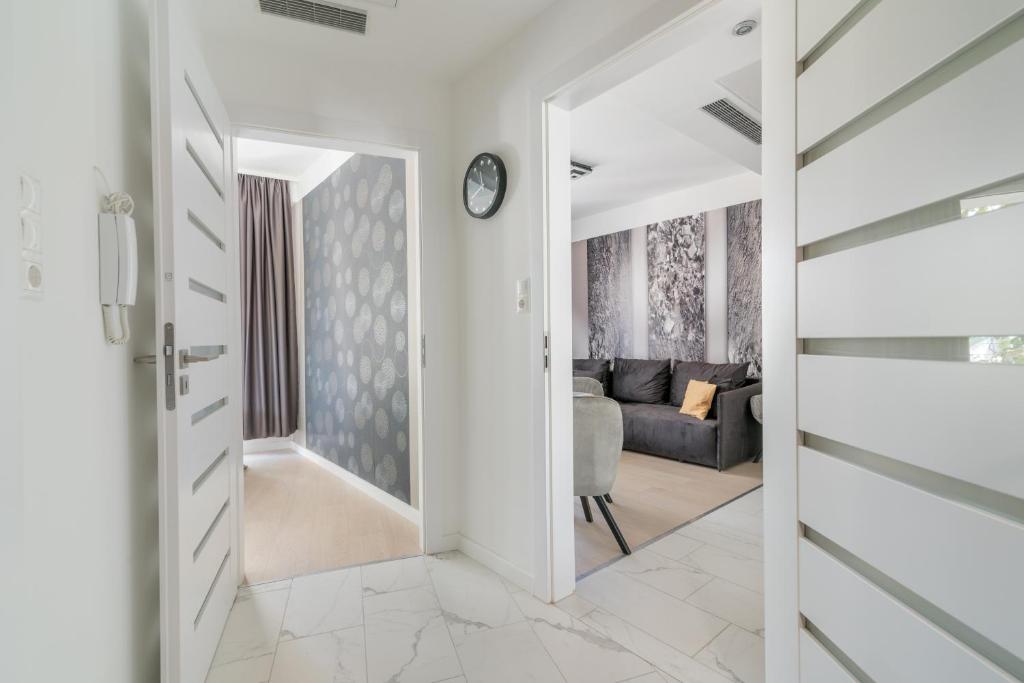 Postel nebo postele na pokoji v ubytování Spa Residence Carbona Hévíz Apartments KAKADU 203 A