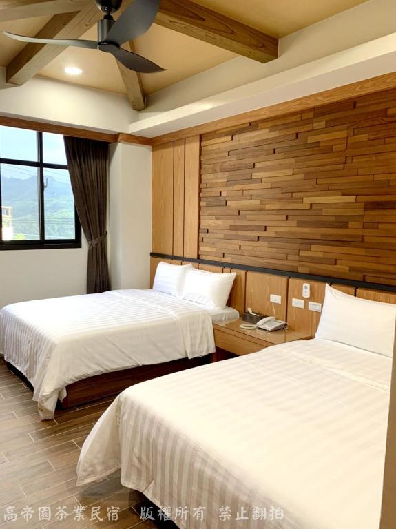 Postel nebo postele na pokoji v ubytování Gaodiyuan Tea B&B 高帝園茶業民宿