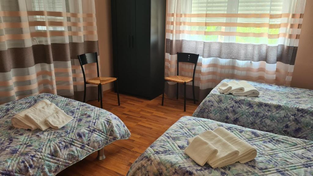 Postel nebo postele na pokoji v ubytování B&B Regina