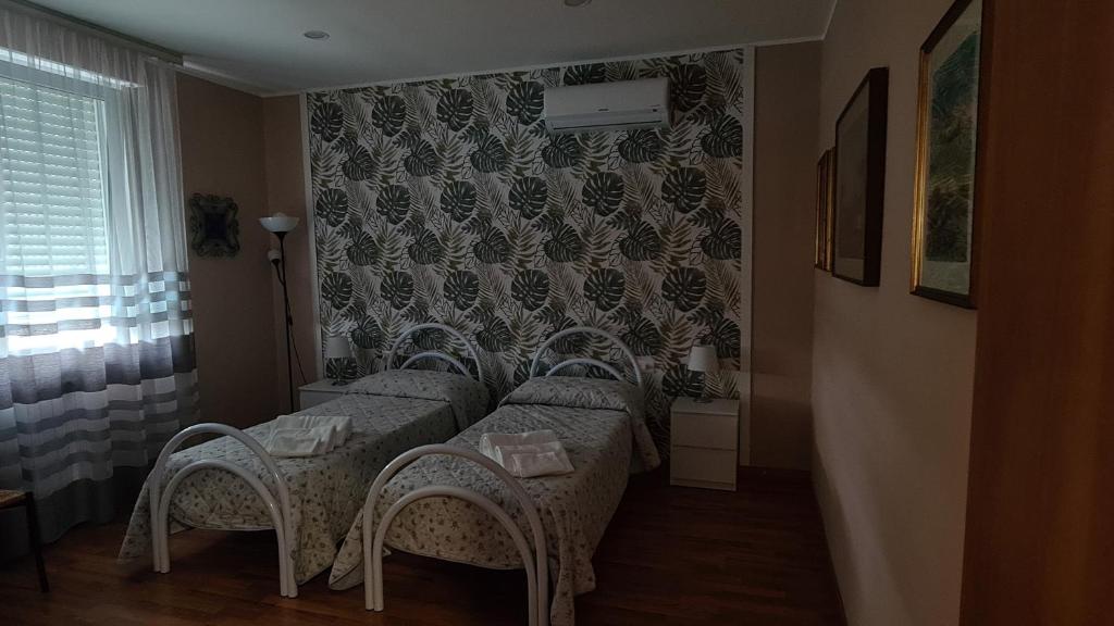 Postel nebo postele na pokoji v ubytování B&B Regina