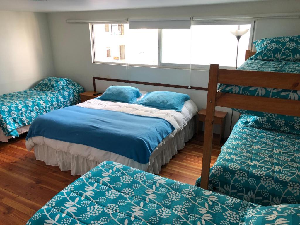 Postel nebo postele na pokoji v ubytování Hostal Magnolio
