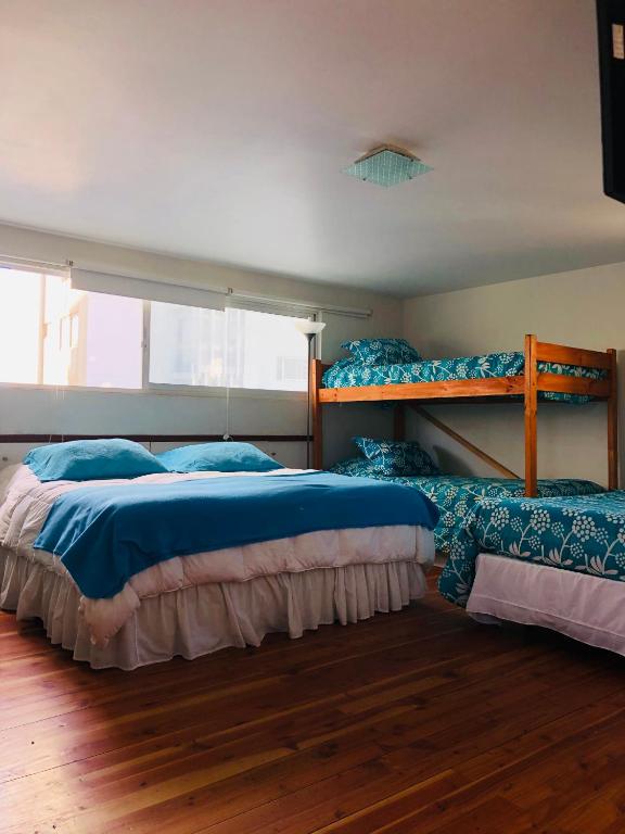 Postel nebo postele na pokoji v ubytování Hostal Magnolio