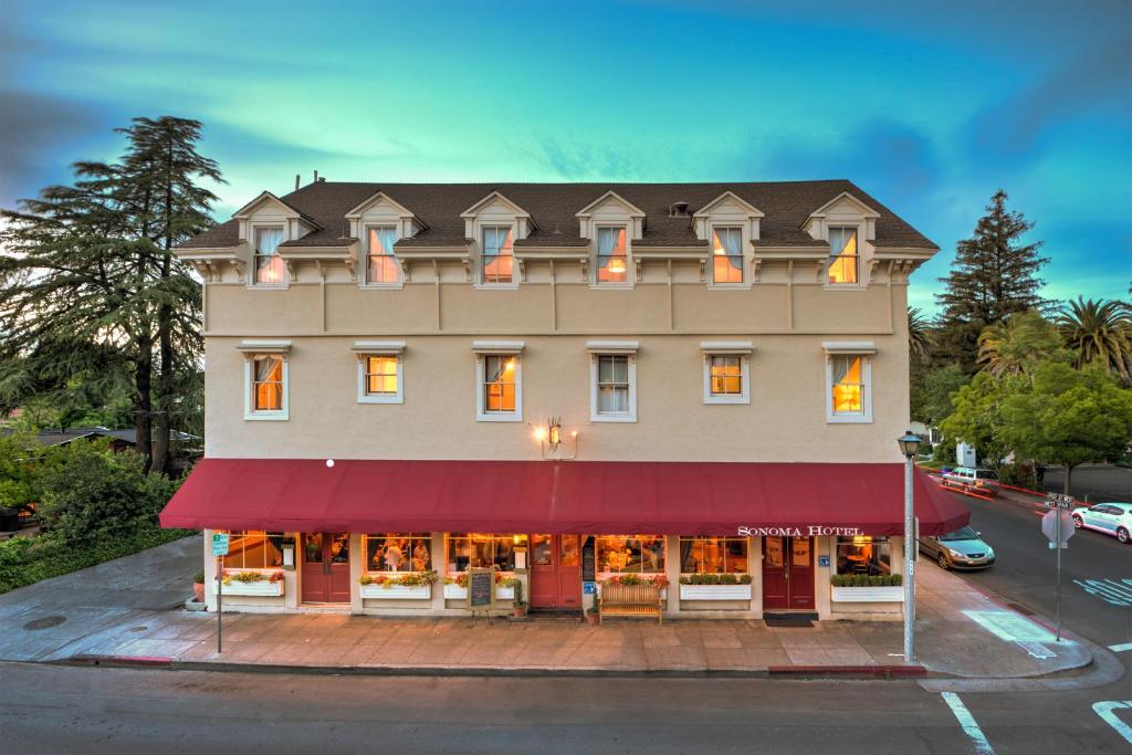 a large building with a red awning at Sonoma Hotel in Sonoma