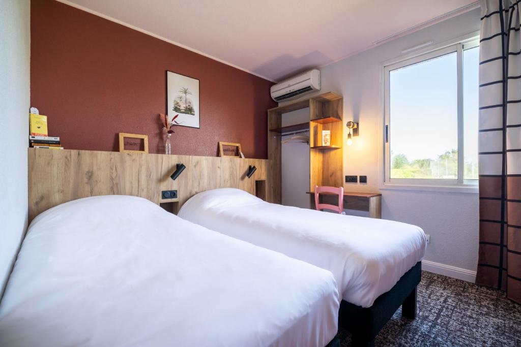 Postel nebo postele na pokoji v ubytování Greet Hôtel Castres Saix