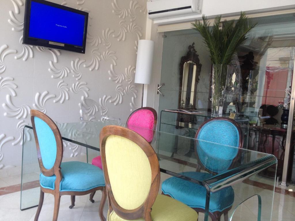 TV a/nebo společenská místnost v ubytování Grand Hotel Tepatitlán