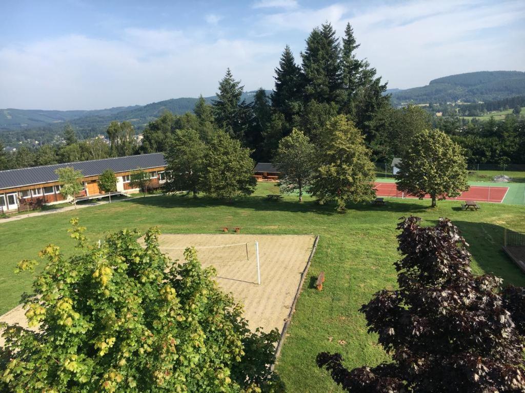 an aerial view of a park with trees and a building at Glynns at Club Correze in Meymac