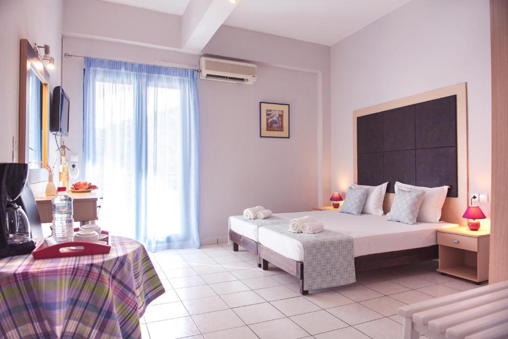 A bed or beds in a room at Christof Studios
