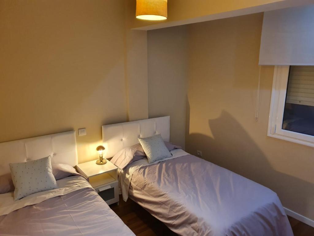 Postel nebo postele na pokoji v ubytování Casa ManPer playa, Alcaravaneras, 3 dormitorios