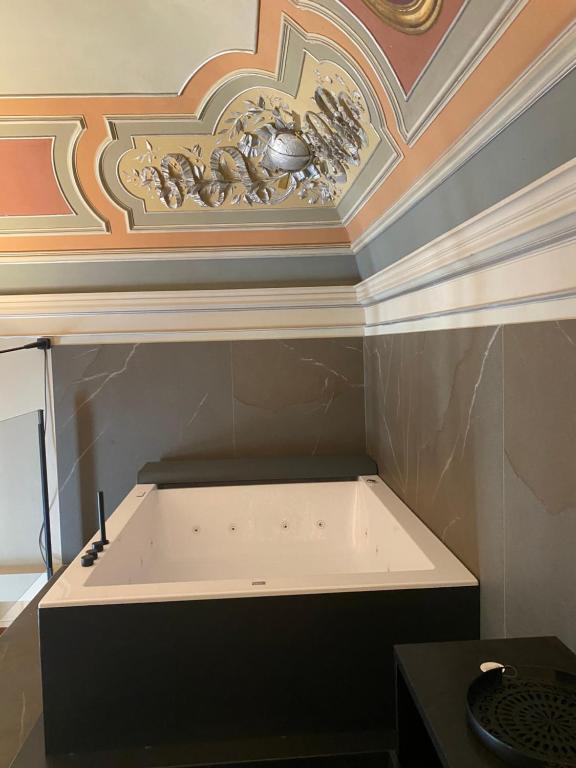 A bed or beds in a room at Duomo Housing Catania Le Suites