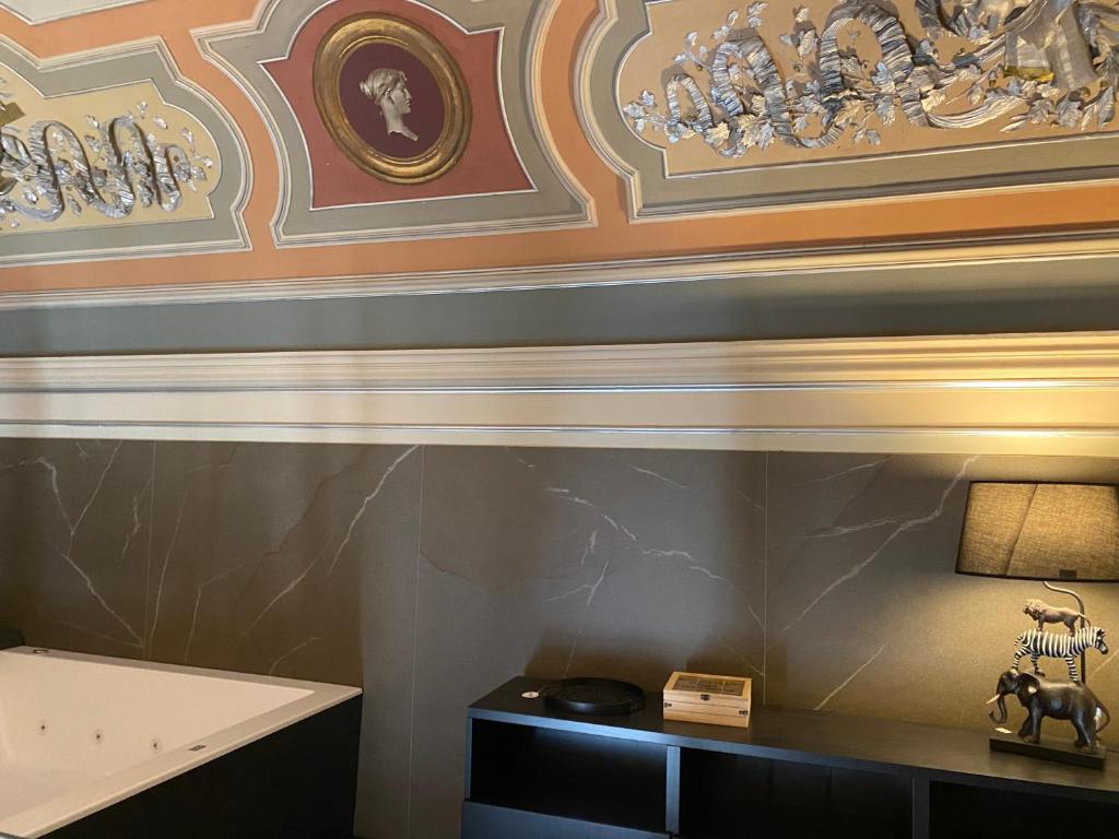A bed or beds in a room at Duomo Housing Catania Le Suites