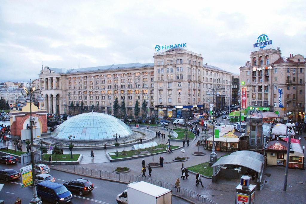 a city with buildings and a street with cars at Central Apartments in Kyiv