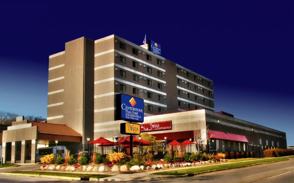 a hotel building with a sign in front of it at Centerstone Plaza Hotel Soldiers Field - Mayo Clinic Area in Rochester