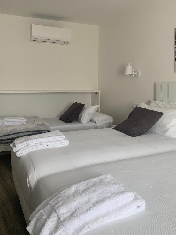 Postel nebo postele na pokoji v ubytování Hostal Comfort Suites