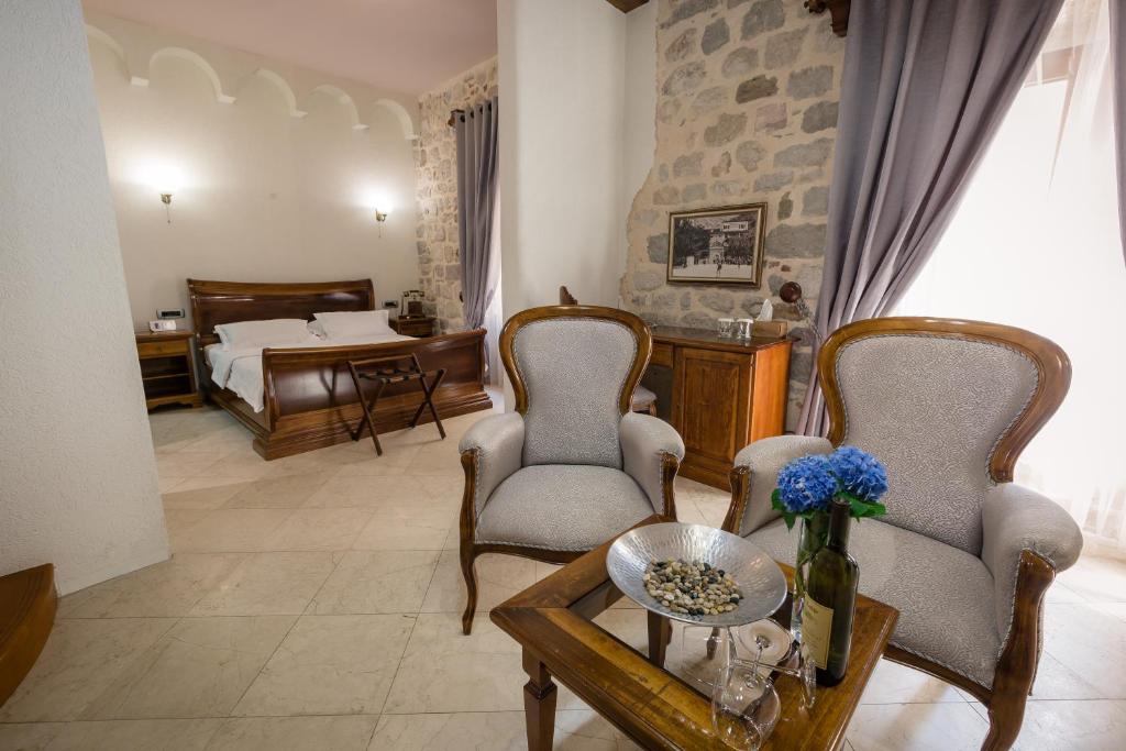 Postel nebo postele na pokoji v ubytování Hotel Villa Duomo
