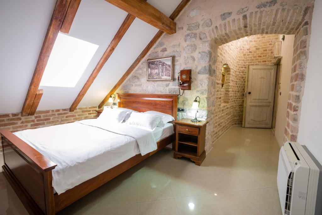 Postel nebo postele na pokoji v ubytování Hotel Villa Duomo